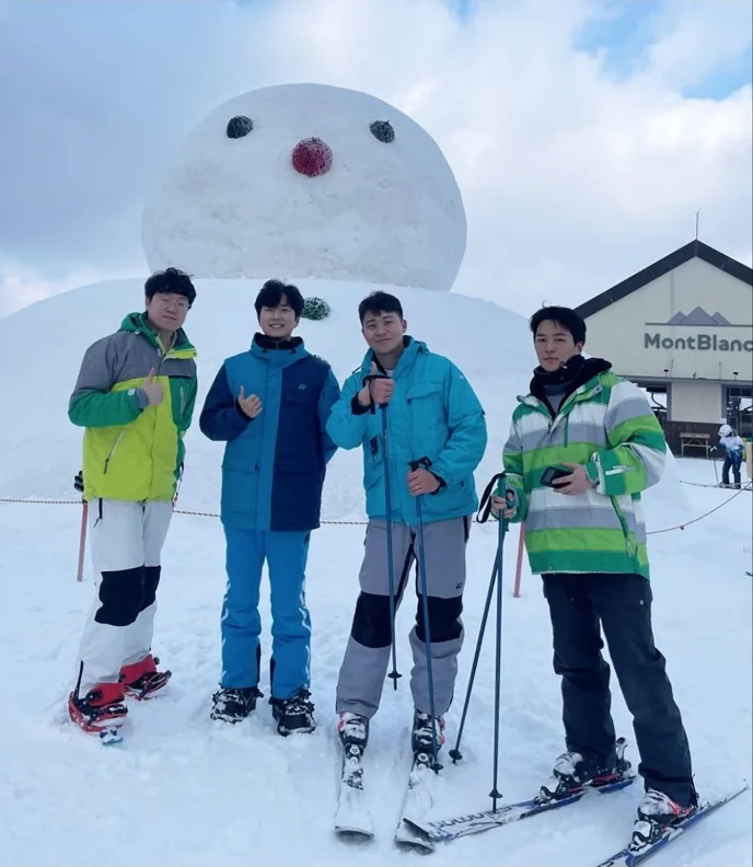 Seungho Han skiing with colleagues